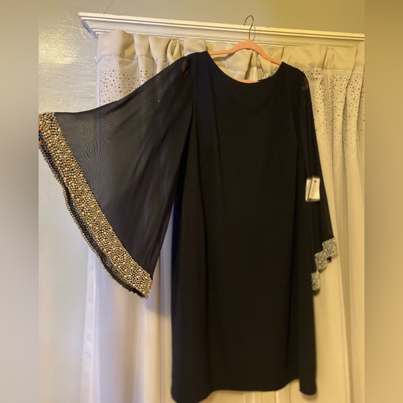 Brand: Xscape
Size: 22W, PTP- 24” w/ some stretch, Length- 42”
Color: Navy Blue - Picture 2 of 3